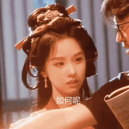 a woman with a bun on her head has chinese writing on her face