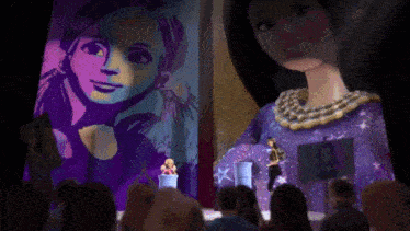 a group of people are sitting in front of a barbie doll