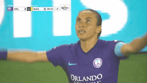 a soccer player wearing a jersey that says orlando