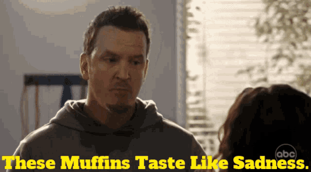a man says these muffins taste like sadness while talking to a woman