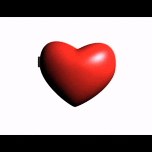 a heart shaped mirror shows a woman 's face