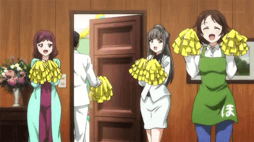 a group of cheerleaders are standing in front of a door holding yellow pom poms