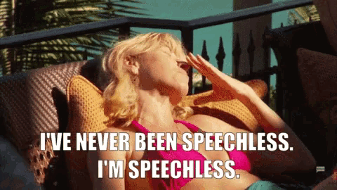 a woman in a bikini is laying on a couch and says " i 've never been speechless ..