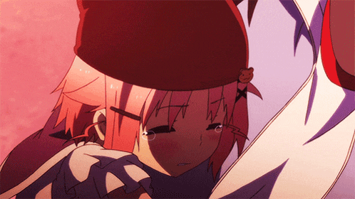 a girl with pink hair and a red hat is being hugged by a man