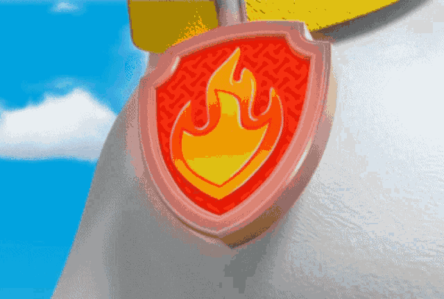 a red and yellow badge with a flaming emblem on it