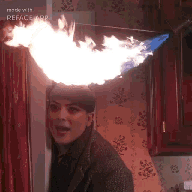 a woman wearing a hat with flames coming out of it is made with the reface app