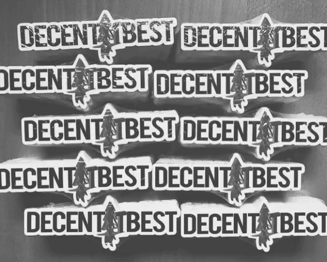 a stack of stickers that say decent best on them