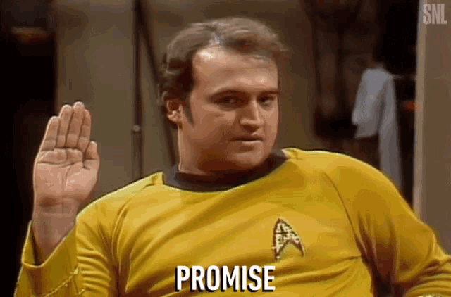 a man in a star trek uniform is making a promise .