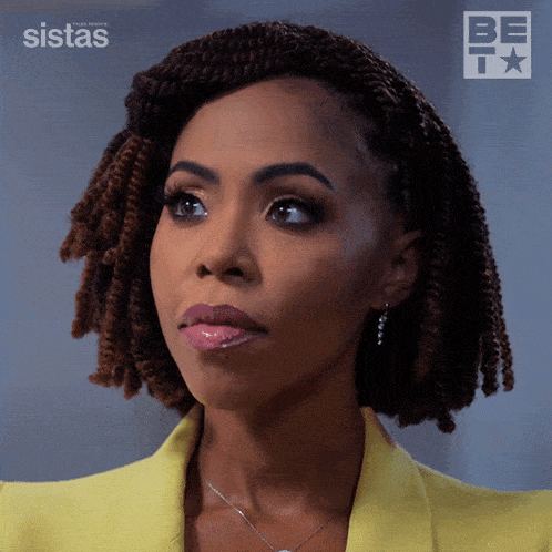 a close up of a woman 's face in front of a sistas logo
