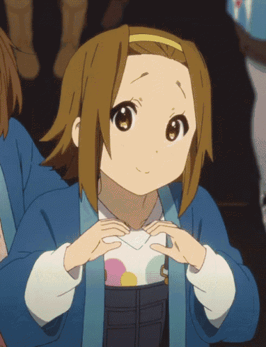 a girl with brown hair is wearing a blue jacket and a white shirt