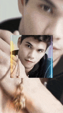 a close up of a man 's face with a rainbow colored border around it
