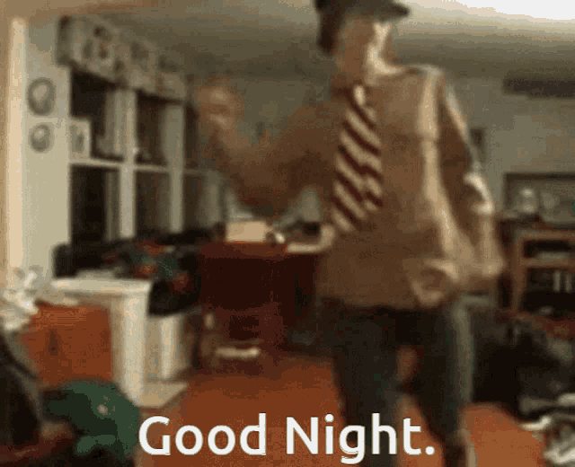 a man in a hat and tie is dancing in a room with the words good night written on the bottom