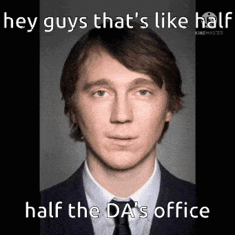 a man in a suit and tie says hey guys that 's like half half the da 's office .