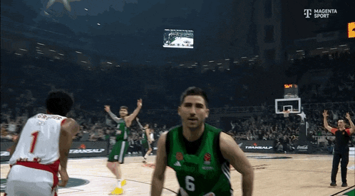 a basketball player wearing a number 6 jersey stands on the court