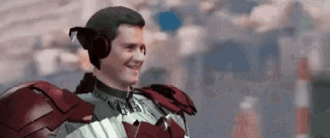 a man in a superhero costume with headphones on