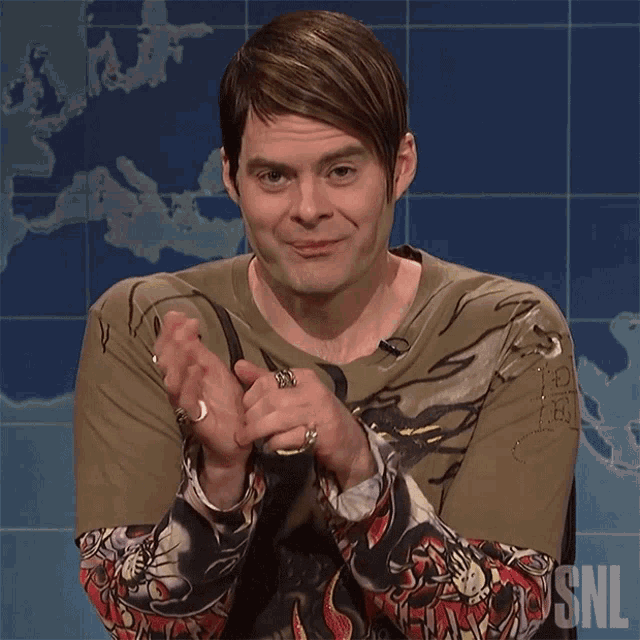 a man wearing a shirt that says snl on the front