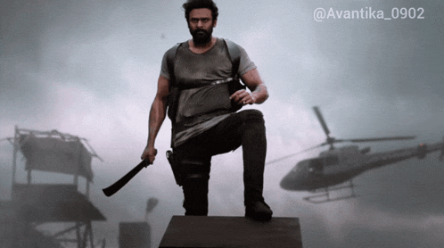 a man holding a machete in front of a helicopter with the hashtag avantika0902