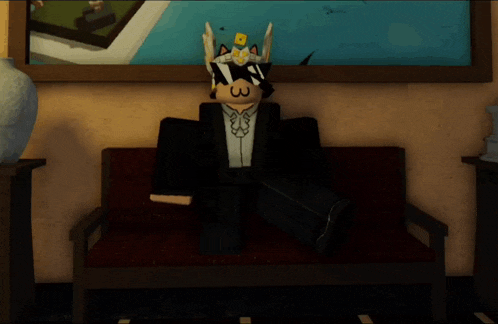 a cartoon character is sitting on a couch with a picture in the background