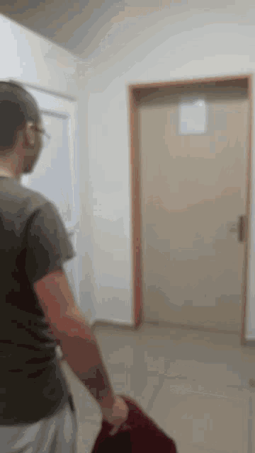 a blurry picture of a man carrying a bag