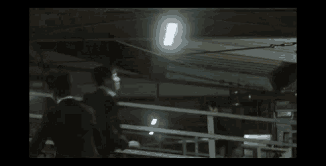 a man in a suit is carrying another man in a parking garage with a yellow sign that says 48