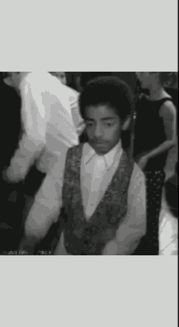 a black and white photo of a man dancing