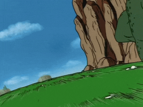 a cartoon character with a red scarf around his head is standing on a hill .