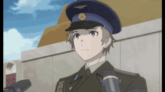 a man in a military uniform is standing in front of a microphone