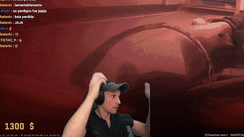 a man wearing headphones is playing a video game with a 1300 dollar donation