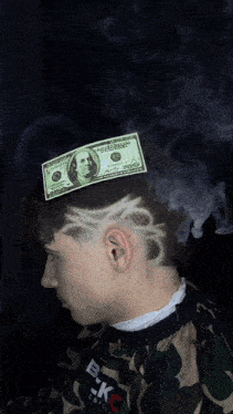 a man with a dollar bill on his head has a drawing of scissors on his hair