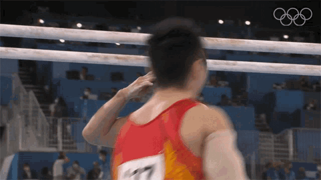 a man with the number 17 on his back salutes