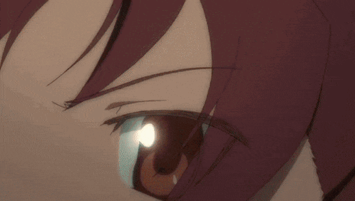 a close up of a person 's eye with a blue pupil
