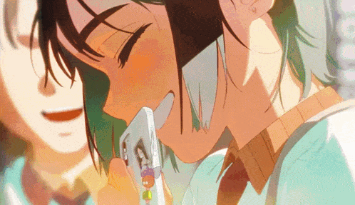 a girl with green hair is talking on a cellphone