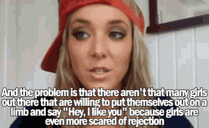 a woman wearing a red hat says " hey i like you " because girls are scared of rejection