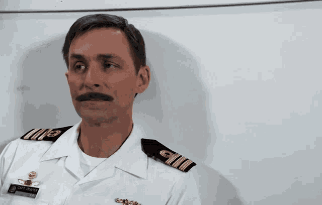a man in a military uniform has a name tag that says capt. o'neill