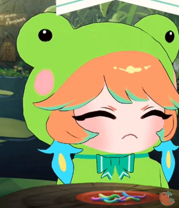 a girl in a frog costume is sitting at a table with a plate of food
