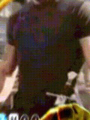 a blurred image of a person wearing a black shirt with the word adidas on it