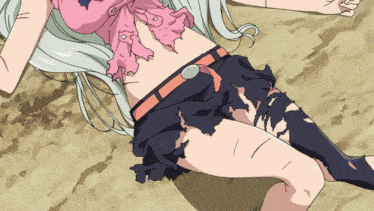 a girl in a pink shirt and a black skirt is laying on the ground