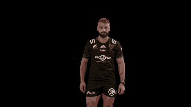 a man with a beard is wearing a pro2pro shirt