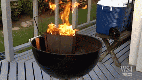 a grill is on a deck with a wsj live sign