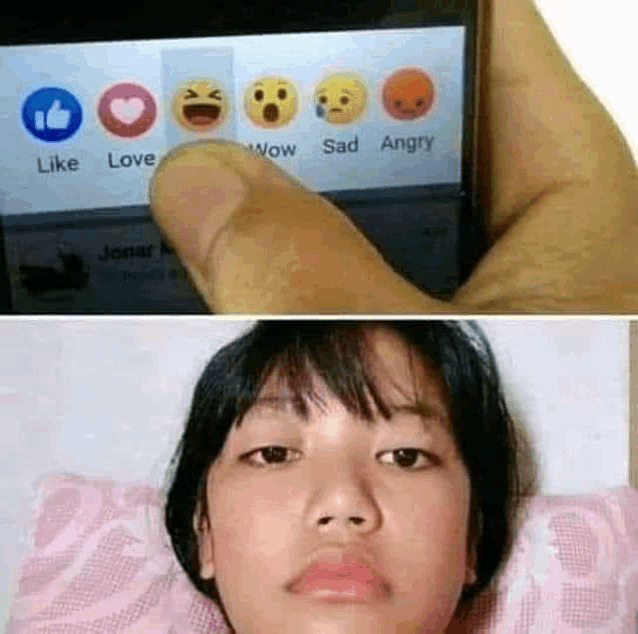 a person is holding a cell phone with a bunch of emojis on the screen .