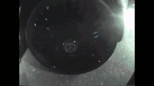 a close up of a black object with a white circle on it