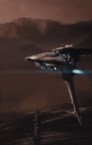 a blurred image of a space ship flying in the sky