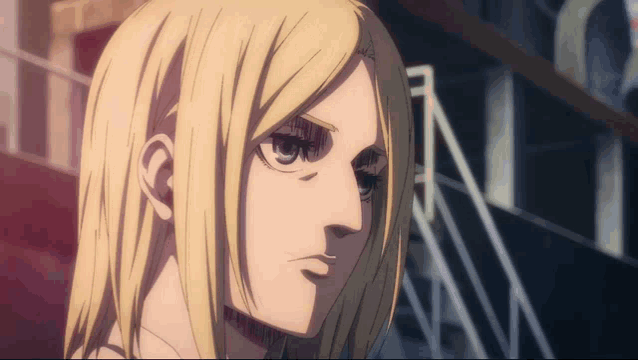 a close up of a person 's face with the letter n visible in the background