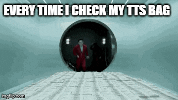 a man in a red suit is walking through a hole in a wall with the words every time i check my tts bag .