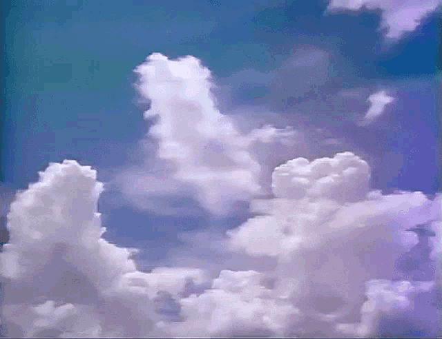 a blue sky with purple clouds in it .