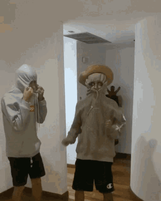 a person wearing a hoodie that says supreme on the front