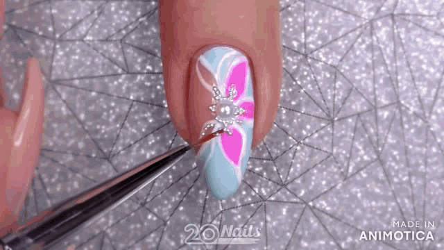 a close up of a woman 's nails with the words made in animatica visible
