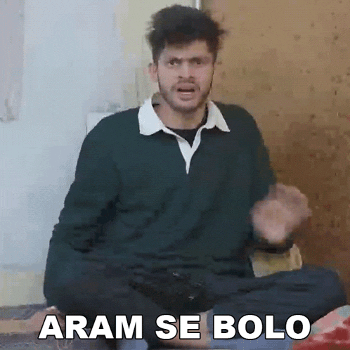 a man is sitting on a bed with the words aram se bolo written on the bottom