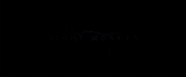 a dark background with night monkey written in blue