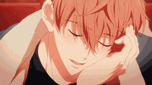 a close up of a person laying down with their eyes closed and their hand on their forehead .